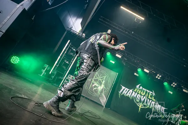 Singer pointing at the crowd from the stage edge